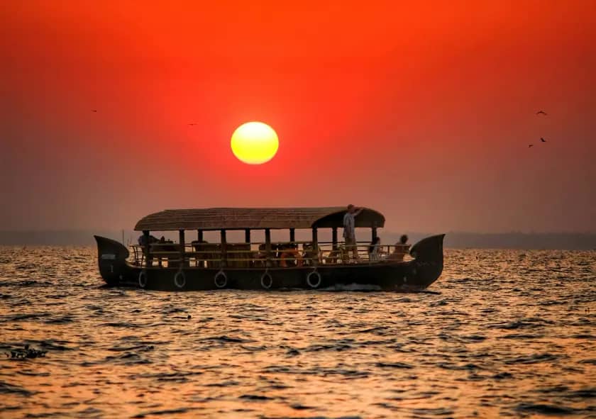 Houseboat on backwaters at sunset
