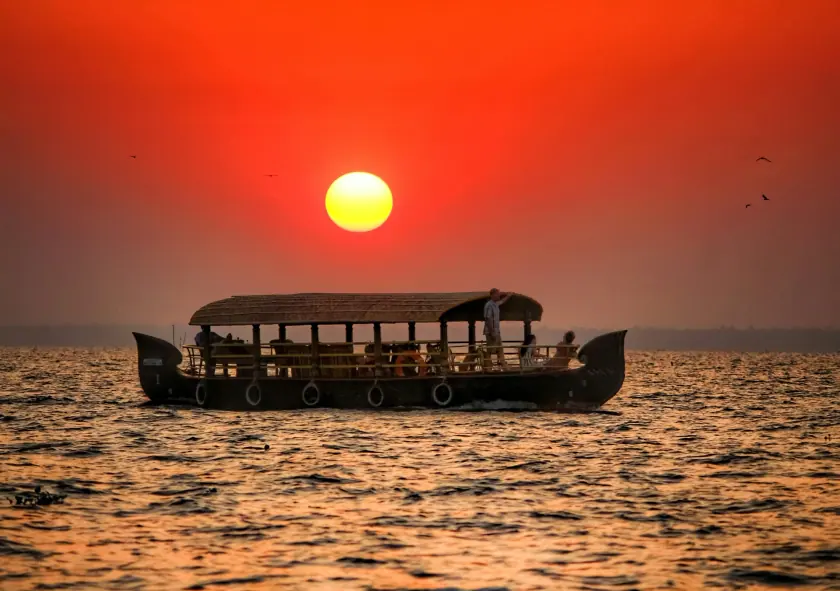 Kerala backwaters with palm-lined canals and houseboats